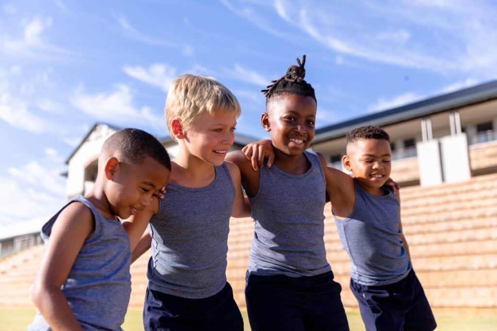 Children enjoying outdoor play to promote safe and healthy athletic experiences for kids.