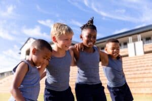 Children enjoying outdoor play to promote safe and healthy athletic experiences for kids.