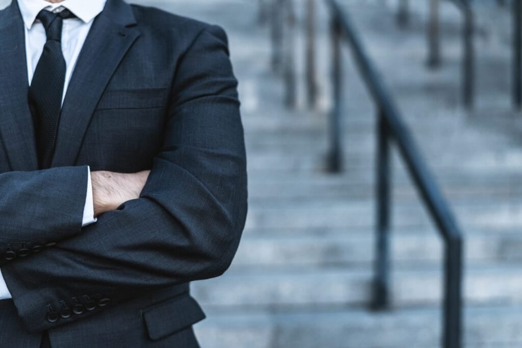 Close-up businessman crossing his hands
