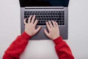 close up, Child's hand on a laptop keyboard.