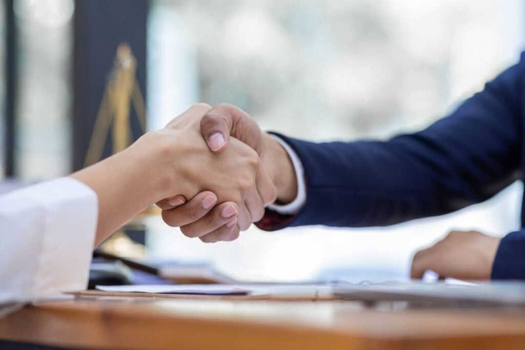 Lawyer and Client Shaking Hands